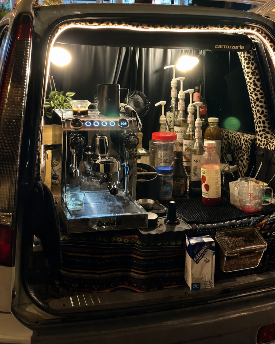Kofh coffee machine at the back of a car
